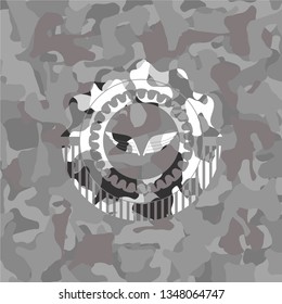 wings icon on grey camouflaged pattern