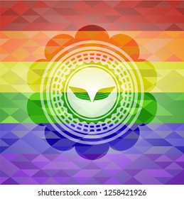 wings icon on mosaic background with the colors of the LGBT flag