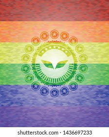 wings icon on mosaic background with the colors of the LGBT flag