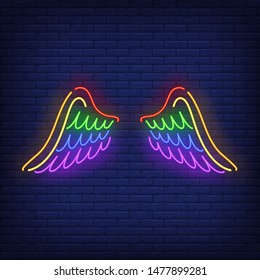 Wings with LGBT colors neon sign. Freedom, tolerance, discrimination design. Night bright neon sign, colorful billboard, light banner. Vector illustration in neon style.