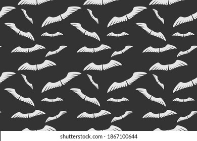 Wings seamless pattern, vector isolated on black.