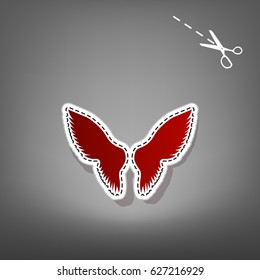 Wings sign illustration. Vector. Red icon with for applique from paper with shadow on gray background with scissors.