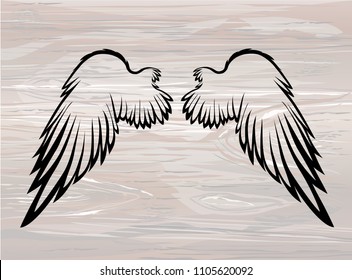 Wings. Vector illustration on wooden background. Black and white style. Linocut.