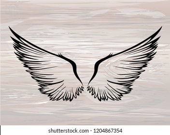 Wings. Vector illustration on wooden background. Black and white style. Linocut.