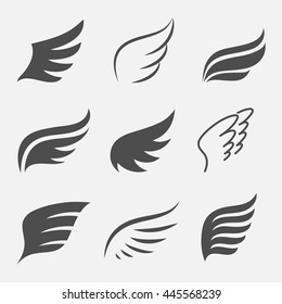 Wings vector set of icons isolated from the background. Abstract wings of a bird or angel for the logo, badges and emblems. 