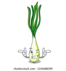 Wink cartoon fresh green onions on cutting board