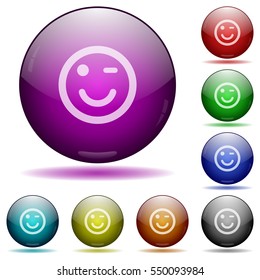 Winking emoticon icons in color glass sphere buttons with shadows