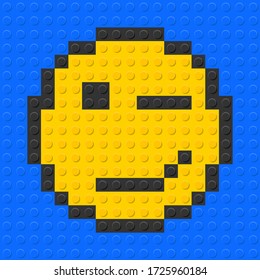 Winking face emoji from plastic building bricks blocks toy. Blue background. vector illustration.