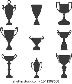 Winner cup icons set. Trophy elements silhouette. Prize signs.