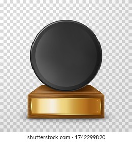 Winner hockey trophy award on wooden stand with empty plate, isolated on background. Black puck on pedestal with golden nameplate. Award prize for victory in ice hockey competition,realistic 3d vector