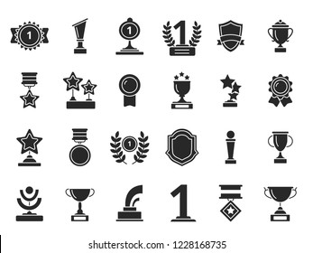 Winners trophies icons. Cups awards medals with ribbons vector black silhouettes isolated