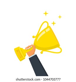 Winning cup in hand. Gold trophy. Symbol of success, winning, championship. Award bowl. Vector illustration flat design. Isolated on background. Leadership concept.