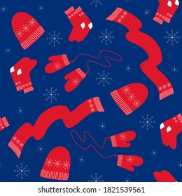 Winter accessories seamless pattern. Warm hat scarf mittens socks red with white snowflakes. New year christmas wrapping scrapbooking paper on blue background. Stock vector flat illustration.