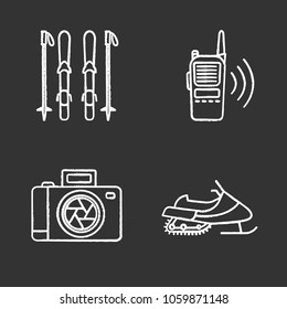 Winter activities chalk icons set. Skiing boards and poles, walkie talkie, photo camera, snowmobile. Isolated vector chalkboard illustrations