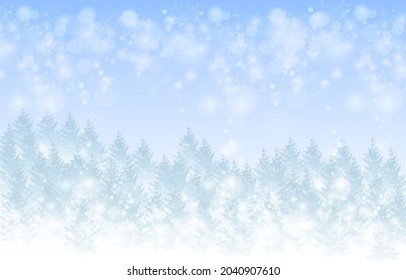 winter background blue fir tree with snowfall bokeh effect 