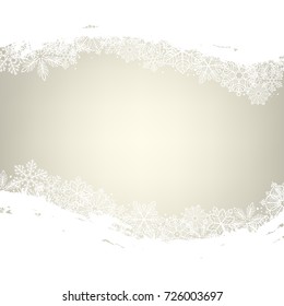 Winter background. Borders made of fluffy snowflakes with space for text on golden background with falling snow.