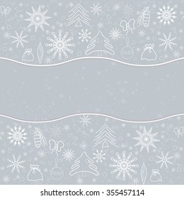 Winter background of delicate snowflakes and Christmas objects on a silver background. For postcards, greetings, and inscriptions.