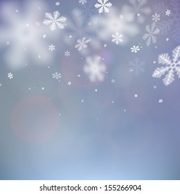 Winter background. Fallen defocused snowflakes. Christmas. Vector.   