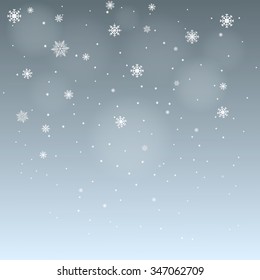 winter background falling snowflakes on blue gray background