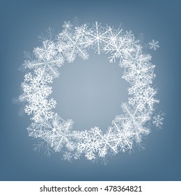 Winter background. Frame made of fluffy snowflakes on soft blue background with space for text.