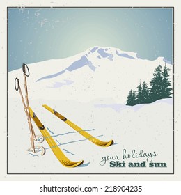 Winter  background. Mountains and ski equipment in the snow