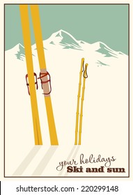 Winter  background. Mountains and ski equipment in the snow