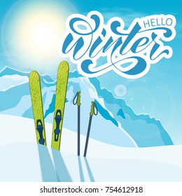 Winter background. Mountains and ski equipment in the snow. Skiing, skier, snowboard, winter, mountains, snow, skis, ski poles, frost, ski trail. 