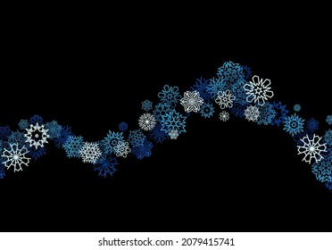 Winter background with snowstorm and sprayed snowflakes for New Years Eve holidays or abstract Christmas greeting card
