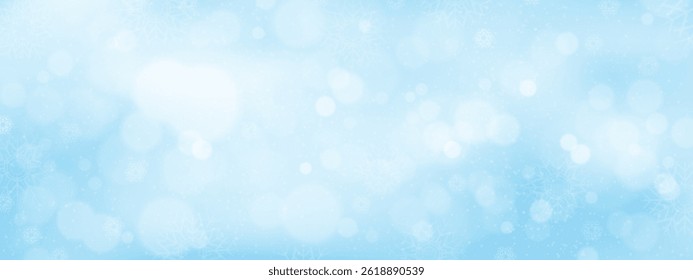 Winter background with soft blue gradient with snow flakes and blurry bokeh light effect,Concept for wallpaper of holiday seasonal for Christmas,New Year 2026 banner