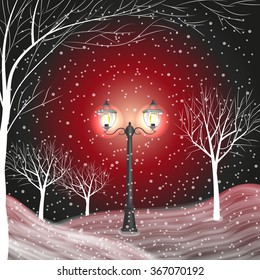 Winter background with vintage lantern in a snow covered park.