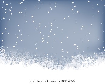 Winter background. Wave border made of fluffy snowflakes with space for text on soft blue background with falling snow.