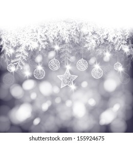 Winter background, white fir branches decorated with baubles and star on bokeh background, Christmas card