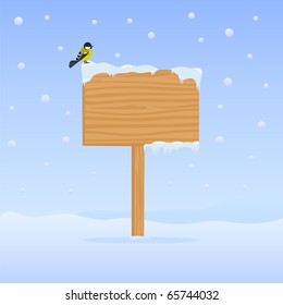 Winter background with wooden billboard and bird on it