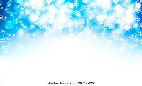 winter blue bokeh background with falling snowflakes
