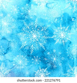 Winter blue watercolor background with white lacy snowflakes