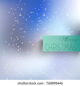 Winter blurred the background with the falling snow. Fall of snow, snowflake on blue sky. Celebratory winter background for Christmas and New year. Falling snow background. Snowfall background.
