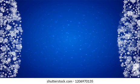 Winter border with white snowflakes for Christmas and New Year celebration. Horizontal winter border on blue background for banners, gift coupon, voucher, ads, party events. Falling frosty snowflakes.