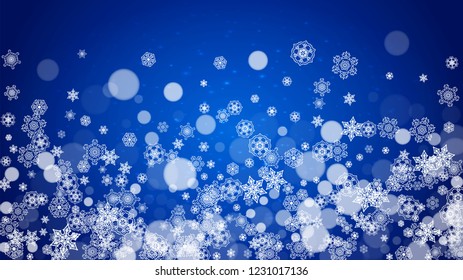 Winter border with white snowflakes for Christmas and New Year celebration. Horizontal winter border on blue background for banners, gift coupon, voucher, ads, party events. Falling frosty snowflakes.