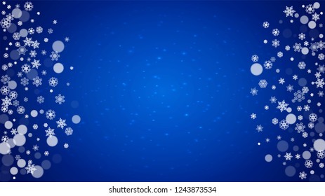 Winter border with white snowflakes for Christmas and New Year celebration. Horizontal winter border on blue background for banners, gift coupon, voucher, ads, party events. Falling frosty snowflakes.