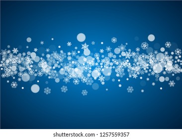 Winter border with white snowflakes for Christmas and New Year celebration. Horizontal winter border on blue background for banners, gift coupon, voucher, ads, party events. Falling frosty snowflakes.