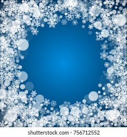 Winter border with white snowflakes for Christmas and New Year celebration. Holiday winter border on blue background for banners, gift coupons, vouchers, ads, party events. Falling frosty snowflakes.