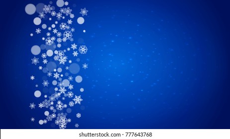 Winter border with white snowflakes for Christmas and New Year celebration. Horizontal winter border on blue background for banners, gift coupon, voucher, ads, party events. Falling frosty snowflakes.