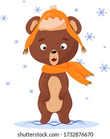 
winter brown bear in a hat stands in a snowdrift and with crests around