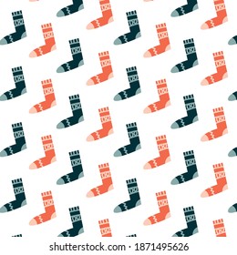 Winter cartoon seamless pattern with socks in different colors on white background. Vector illustration.