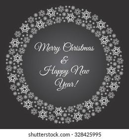 Winter chalk drawn round frame made of snowflakes. Merry Christmas and Happy New Year illustration on black board. Greeting card with circle made of brush or pencil drawn snow crystals.
