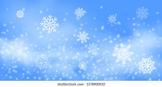 Winter Christmas background with sky, heavy snowfall. Falling Christmas Shining white transparent beautiful snow. Happy new year decoration. Snowflakes, snowfall.