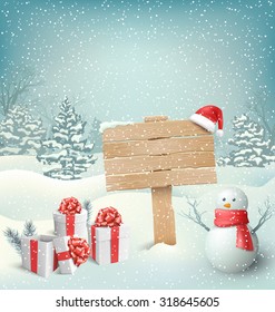 Winter Christmas Background With Wooden Signpost Snowman And Gift Boxes