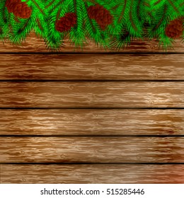 Winter christmas background.Christmas tree and pine on the wooden background.