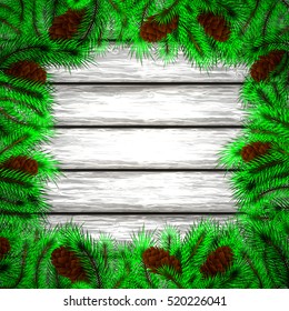 Winter christmas background.Christmas tree and pine on the wooden background.