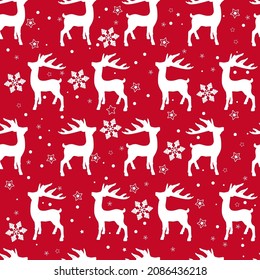 Winter Christmas seamless pattern with silhouettes of deer and snowflakes.